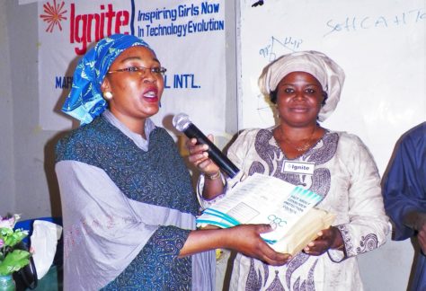 Muhybat Abdulsalam presented books to the host school principal, Edith